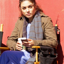 Mila Kunis is seen texting during a break from filming 'The Angriest Man in Brooklyn' in Los Angeles