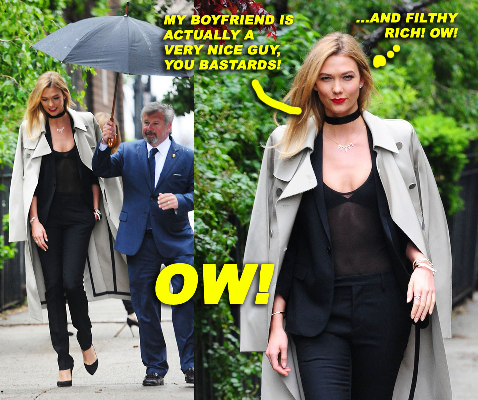 Karlie Kloss has a helper carry her umbrella as she is spotted out and about in NYC